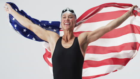 young caucasian female athlete swimmer celebrates a victory