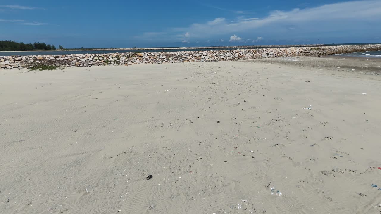 Aerial View Dolly of Walking on the Secret Beach in Vung Tau in the Morning