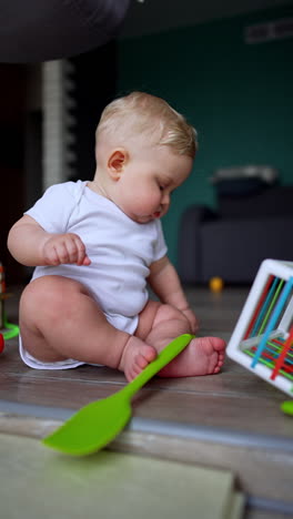 small cute child portrait. cheerful funny newborn baby. vertical video.