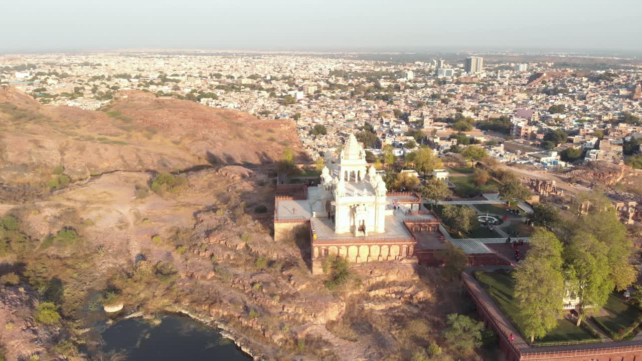 Jaswant Thada cenotaph standing on the edge of blue city of Jodhpur, Rajasthan, India - Aerial Orbit shot