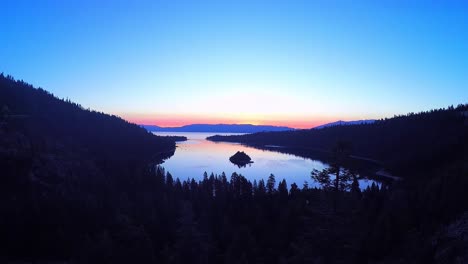 a beautiful aerial shot at dawn over emerald bay lake tahoe