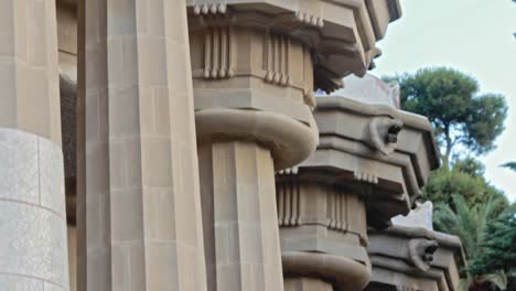 columns building and facade historical monument in park guell barcelona