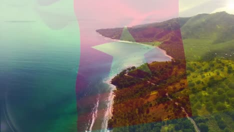 Digital-composition-of-waving-cameroon-flag-against-aerial-view-of-the-sea