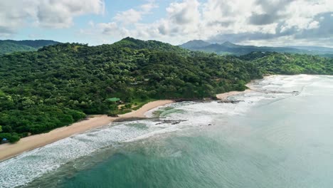 cinematic sunrise aerial forward on the beach of san juan del sur, nicaragua