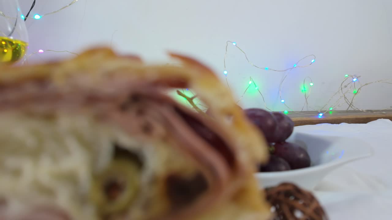 Colorful Christmas lights and grapes in close-up shot with a festive atmosphere