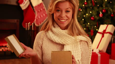 pretty blonde opening gift at christmas