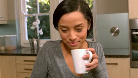 pretty woman drinking by white cup