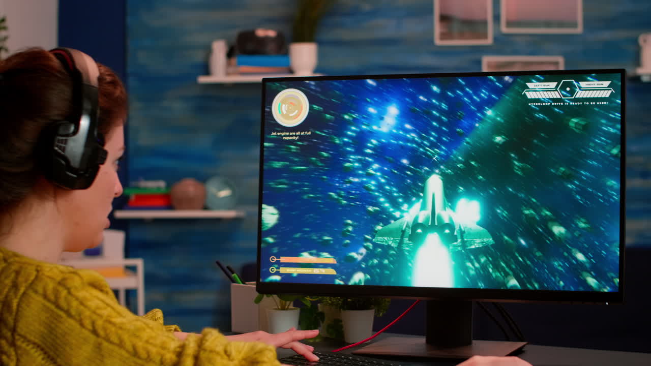 Videogamer using professional computer playing space shooter video game