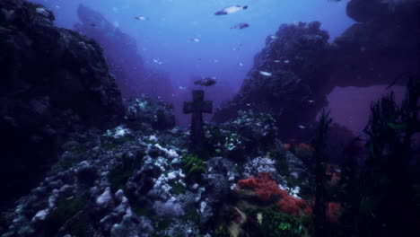 escena submarina de arrecife de coral con una cruz y vida marina vibrante