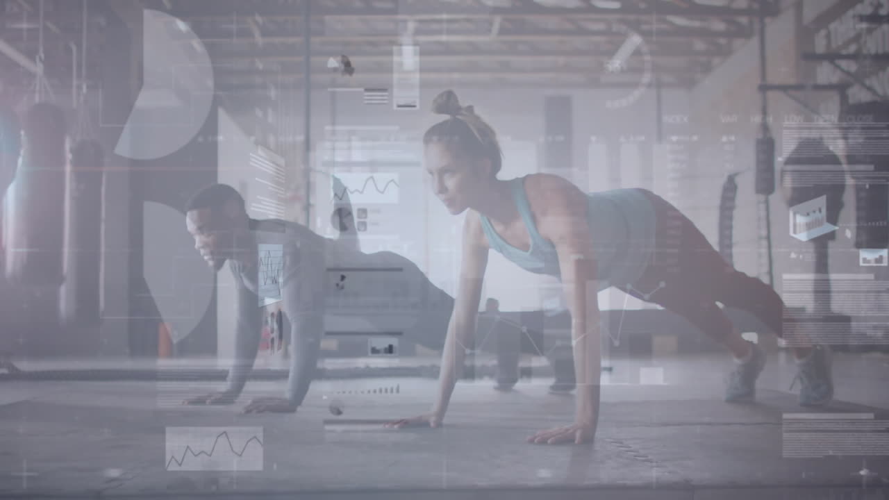 Man and woman doing synchronized push-ups in industrial gym, displaying floating performance charts