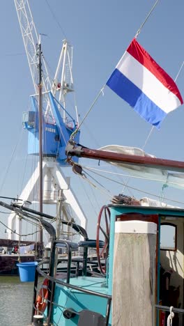 dutch harbor with crane and flag