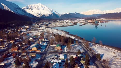 4k drone video of homes in seward, alaska on a snowy winter day