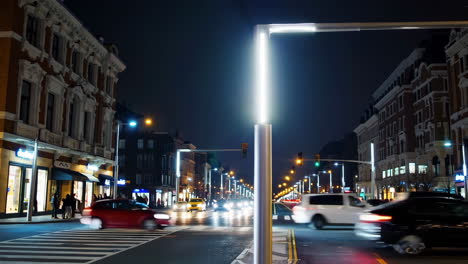 dynamic nighttime city street with moving vehicles