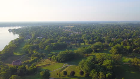 Gorgeous-early-morning-aerial-flying-over-a-scenic-small-town