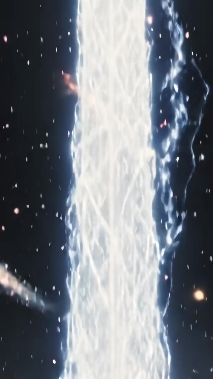 Video verticale: Dopo un'esplosione alla base, lancio di un getto intrecciato da un disco al centro, che rilascia energia come plasma.