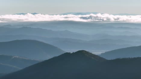 silhouetted layers of mountains in landscape, top aerial view, serra da estrela