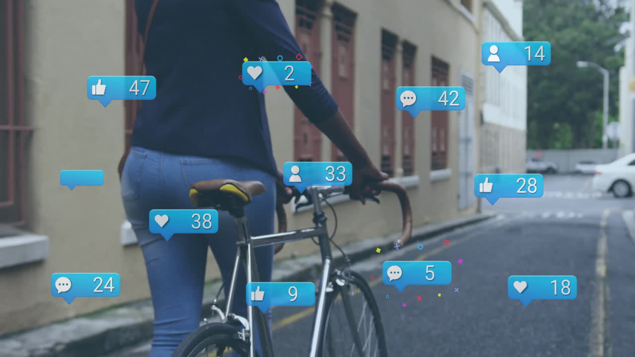Animation of media icons over biracial woman walking with bicycle