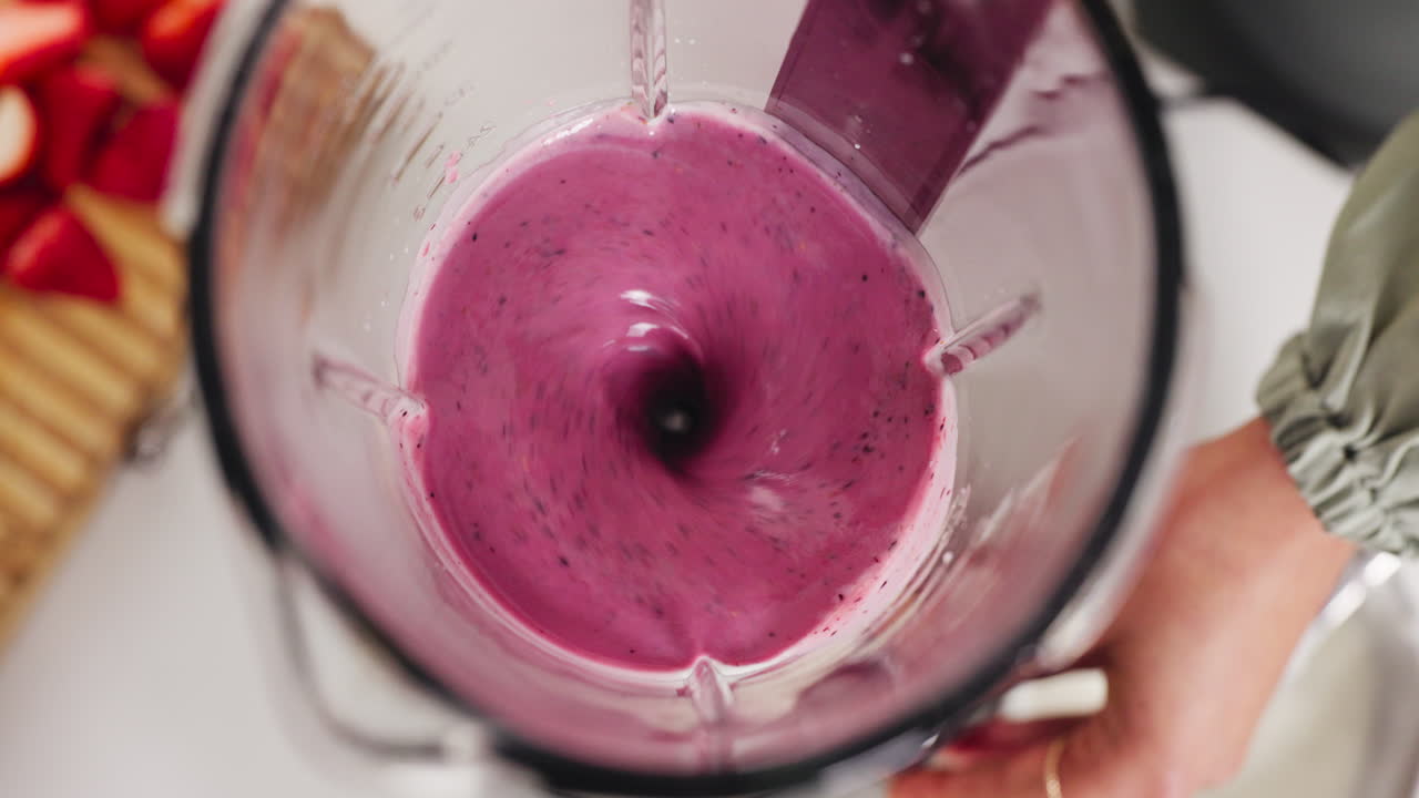 Making a purple smoothie in a blender