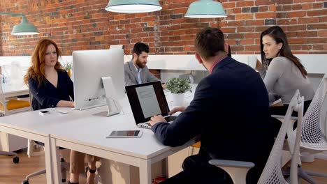 business executives working at desk