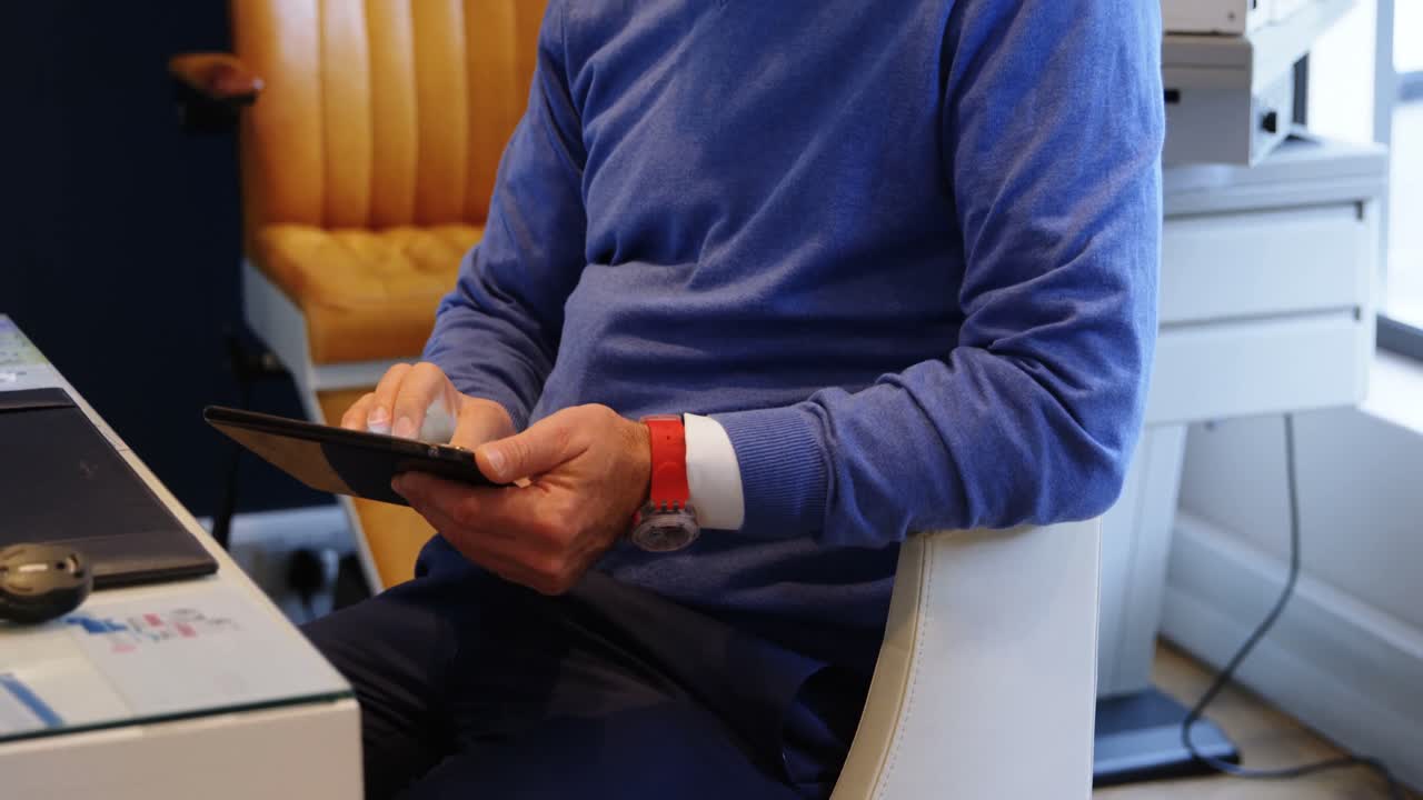 Optometrist using digital tablet in clinic 4k