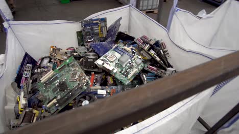 steady medium moving shot of electronic parts ready for recycling