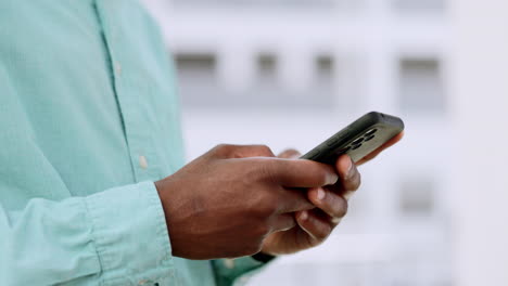 Phone,-hands-and-black-man-typing-outdoor