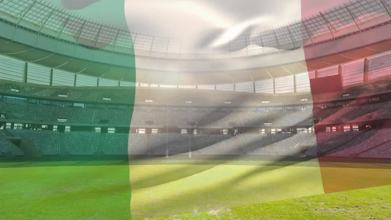 bandera ondeando frente a un estadio