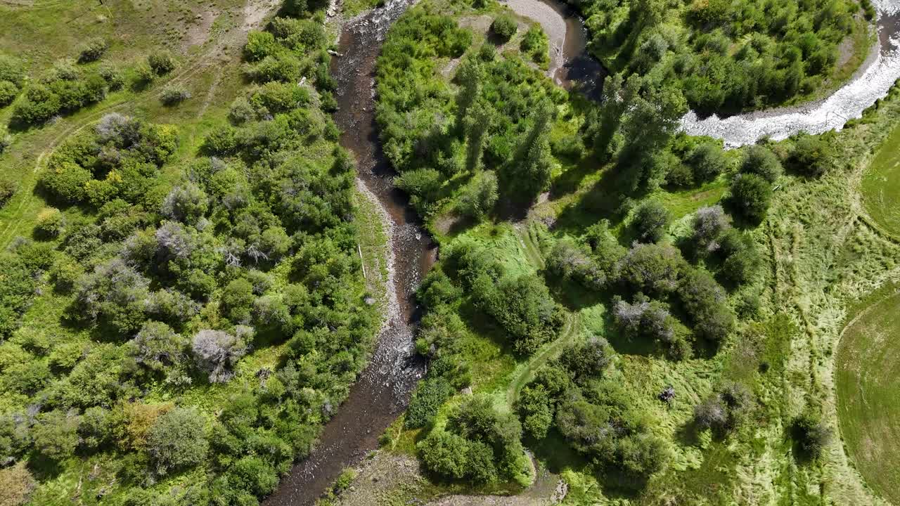 Drone Shot of Creek and Road in Valley of Elk Mountains, Colorado USA on Sunny Summer Day