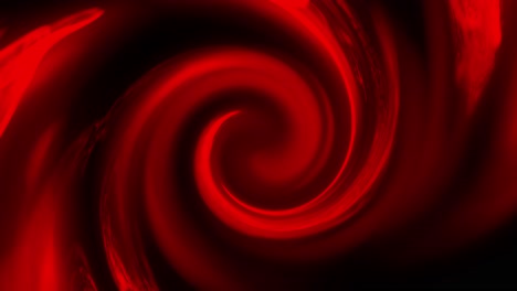 vortex of red swirling fluid moving slowly on black background