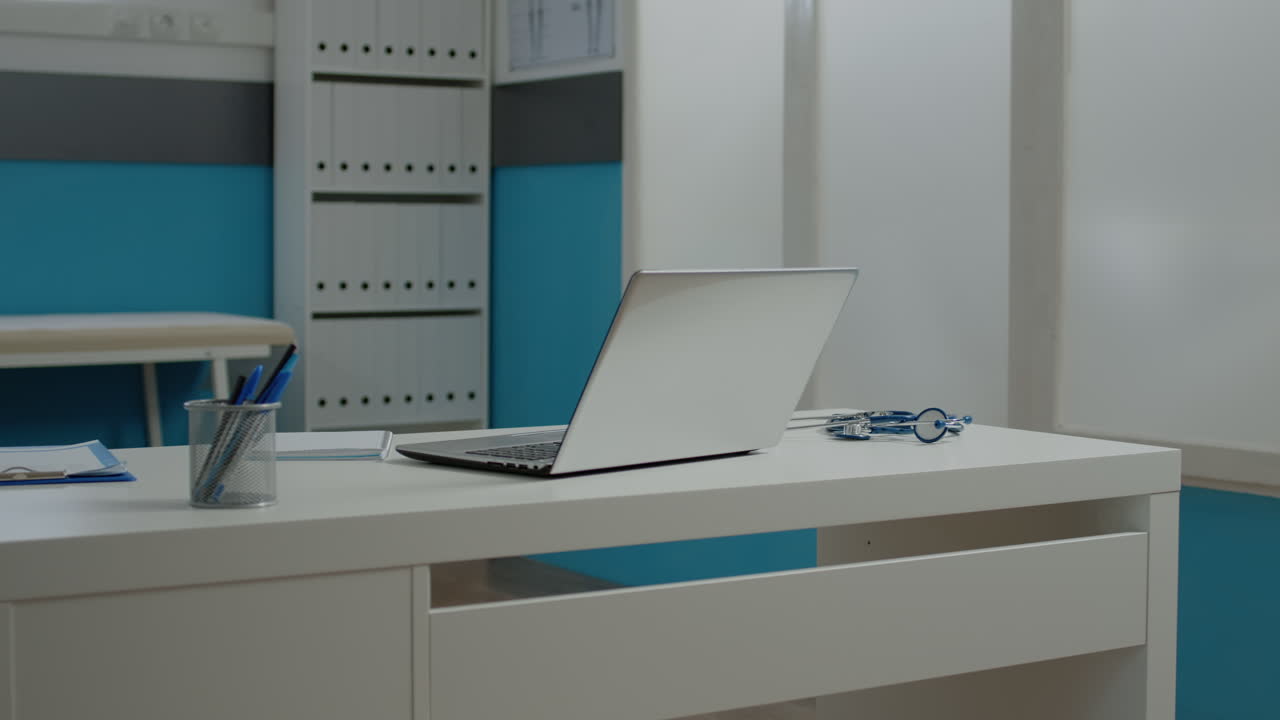 Doctor's Office with Desk and Laptop