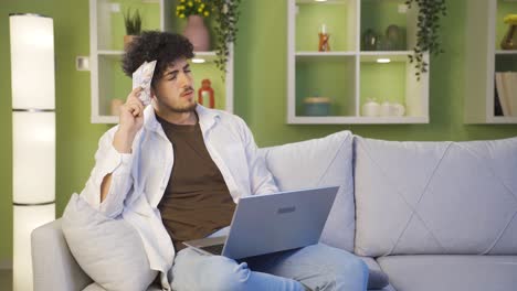 Young-thoughtful-man-with-money-in-hand.