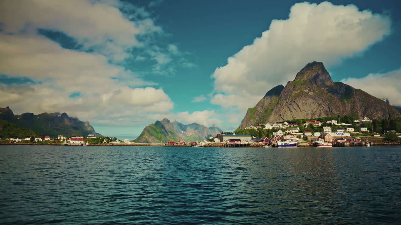 Boat tour along the Norwegian fjords in the Lofoten islands, Norway. View green mountainous landscape