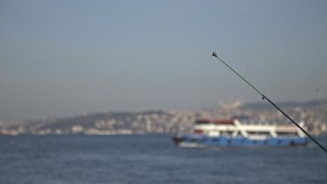 Fishermen-fishing-on-the-Bosphorus,-Galata-Bridge,-with-a-sea-view