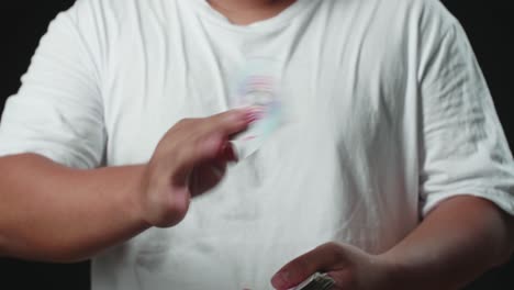 magician showing his trick with usual cards, change card