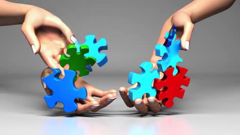 hands assembling colorful puzzle pieces: a metaphor for teamwork and problem solving