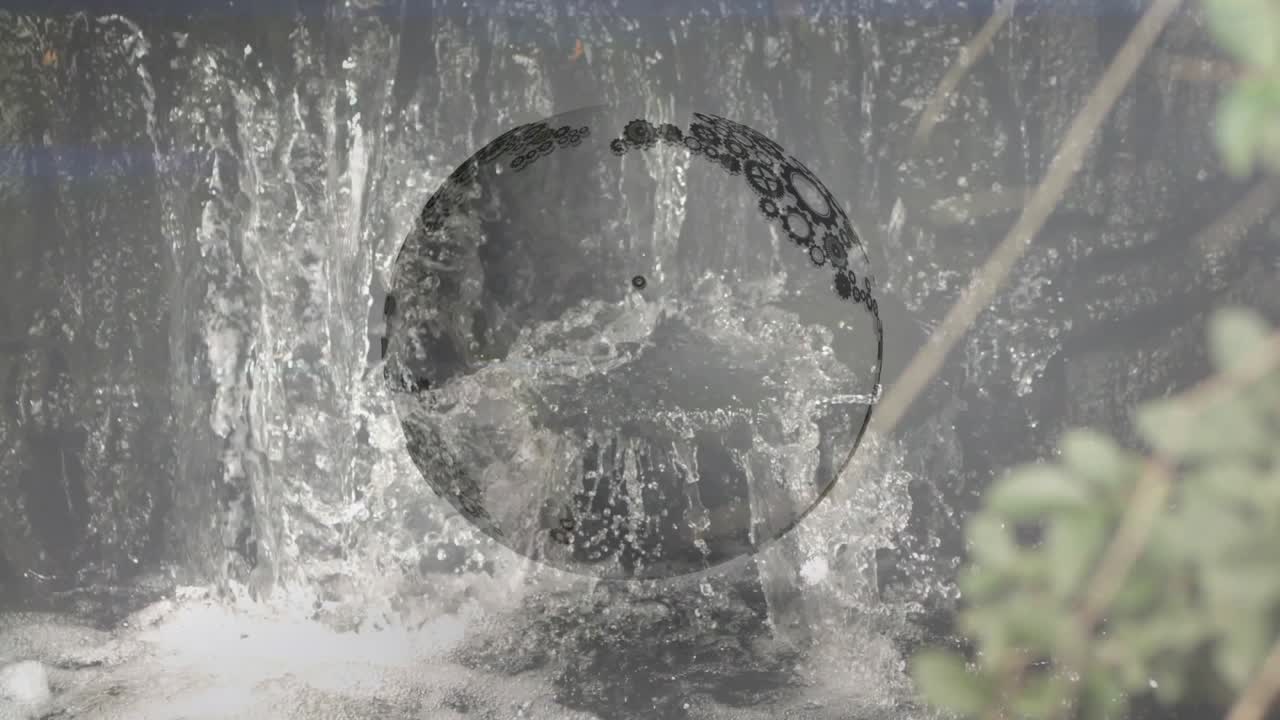 Start frame starting globe disc rotating over waterfall while water flowing through gear map reveal