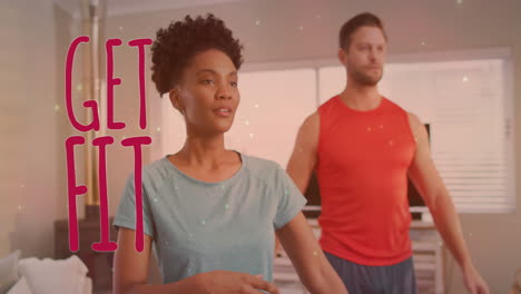 animation of get fit text over diverse couple stretching arms at home