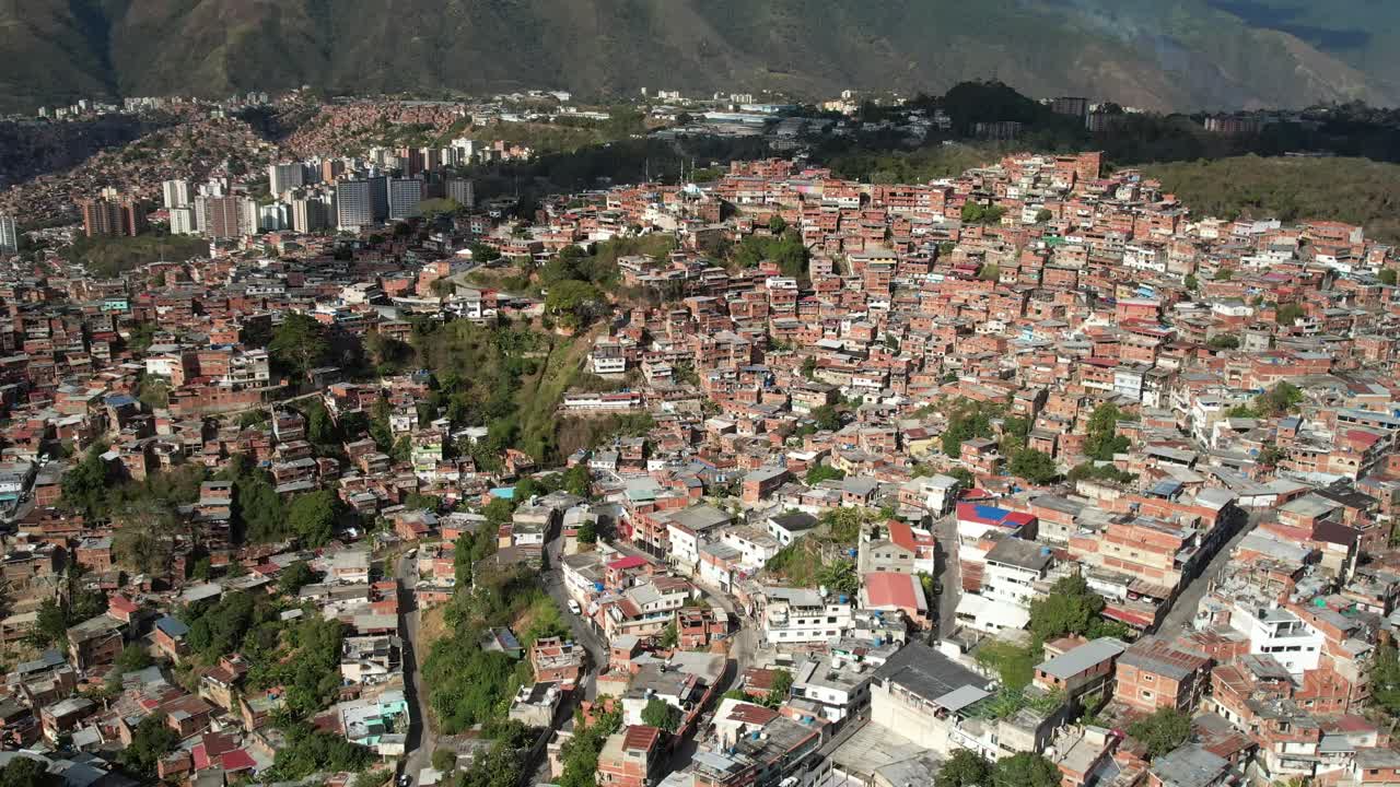 A densely populated hillside in petare, miranda, venezuela, showcasing homes, aerial view