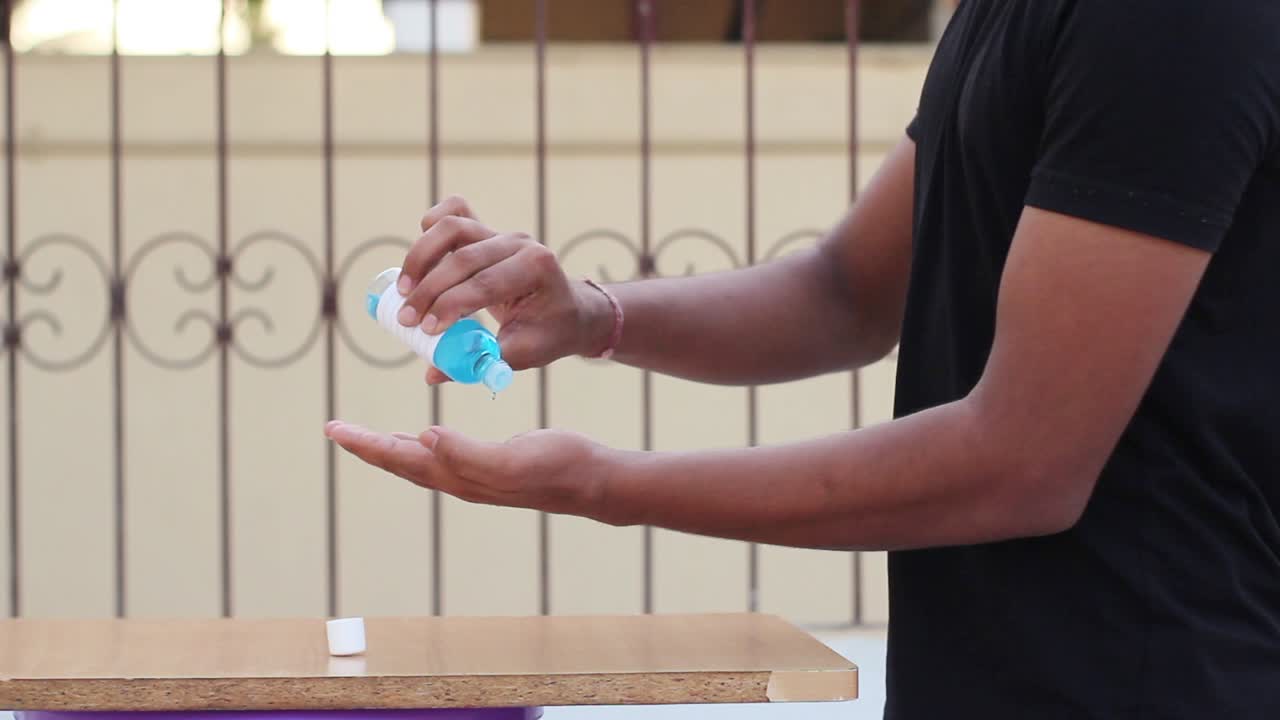 Young Asian boy applying sanitizer from bottle on dirty hands, global epidemic recovered from virus Concept of health and safety life, corona virus, virus protection, pandemic in world