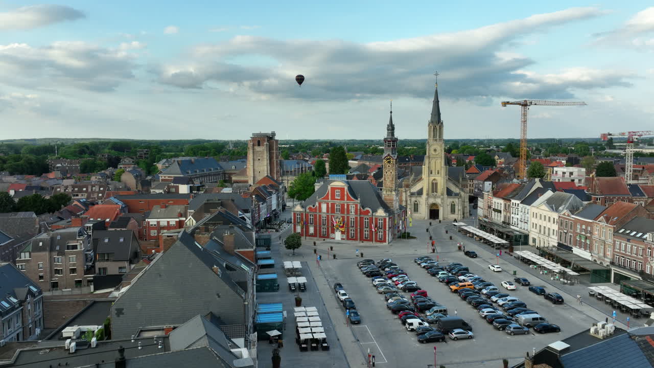 Aerial Establishing Sint-Truiden City Center with Town Hall and Church of Our Lady on the Market Square DOLLY IN