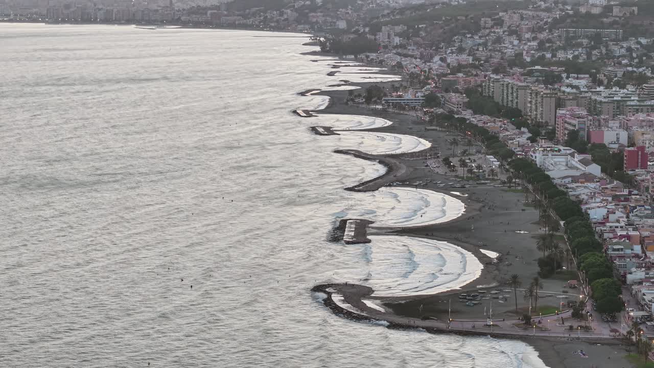gentle waves across Pedregalejo and El Palo coves in Malaga - aerial
