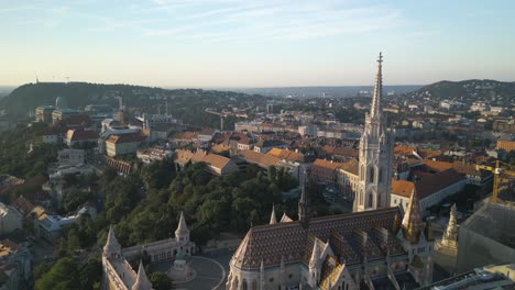 aerial boom shot above castle district in budapest, hungary at sunrise