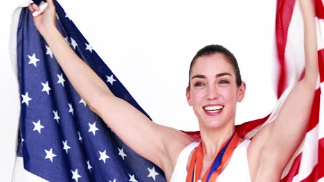 Atleta-Feliz-Sosteniendo-La-Bandera-Americana