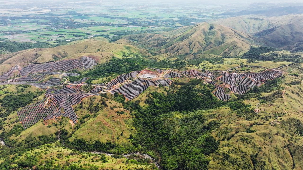 Expansive solar infrastructure blankets remote Philippine mountain terrain wide