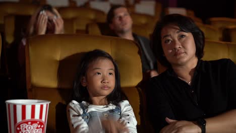 people audience watching movie in cinema theater.