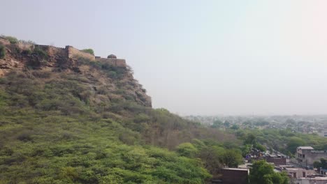 Aerial-Drone-shot-of-a-Temple-at-a-hill-of-Gwalior-Fort,-Madhya-Pradesh