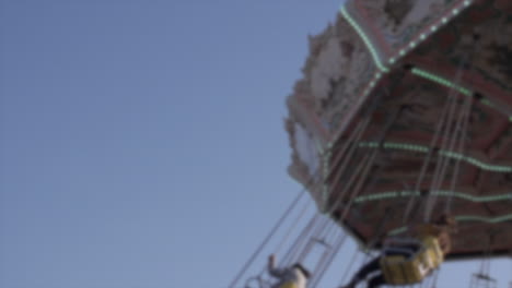 Amusement-park-spinning-ride-blurred-Slow-Motion