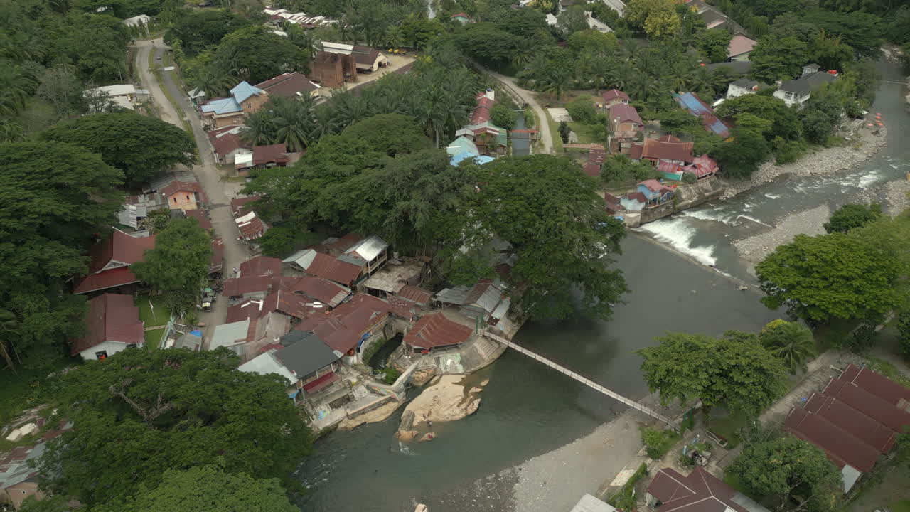 Drone Shot of Bukit Lawang beside the River in Indonesia