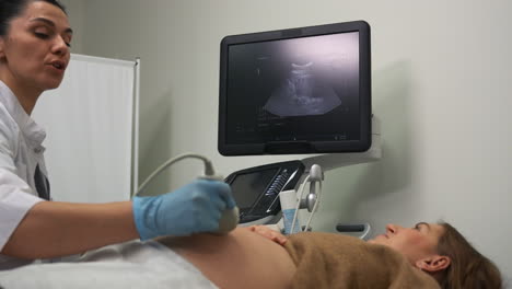 pregnant woman laying on stretcher