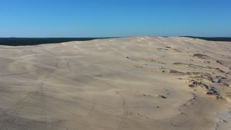 dune du pilat sandhill in arcachon bassin france opposite cap ferret with a height of over 100 meters, aerial flyover shot